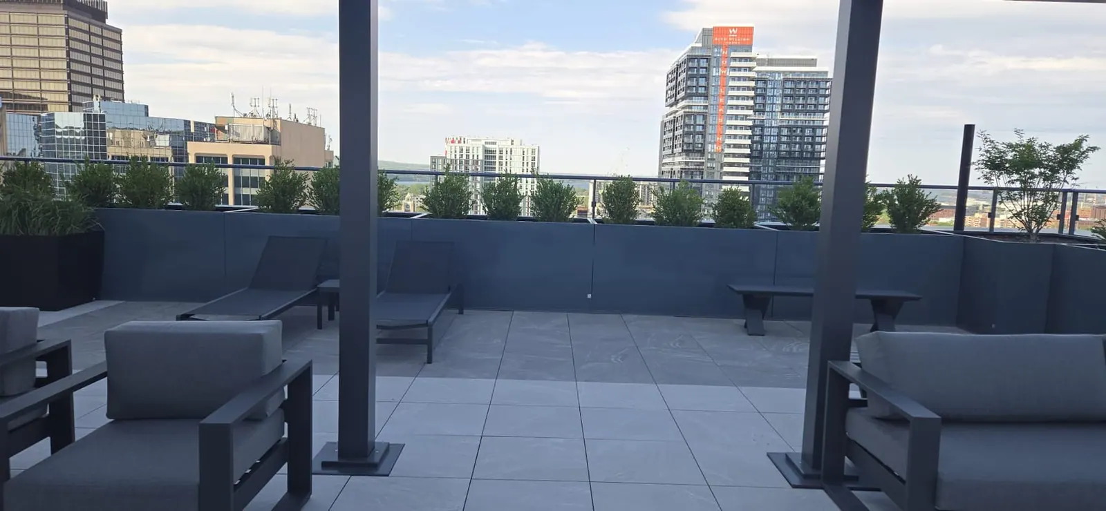 View from under the rooftop pergola toward the downtown skyline